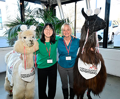 Michelle and Regina with alpaca and llama